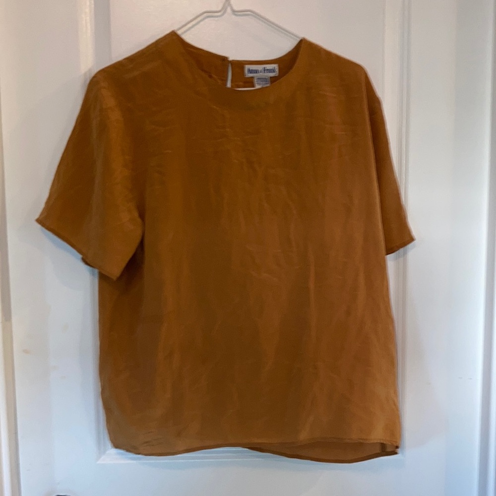 Anna and Frank XL but seems small than an XL wore barely Silk material